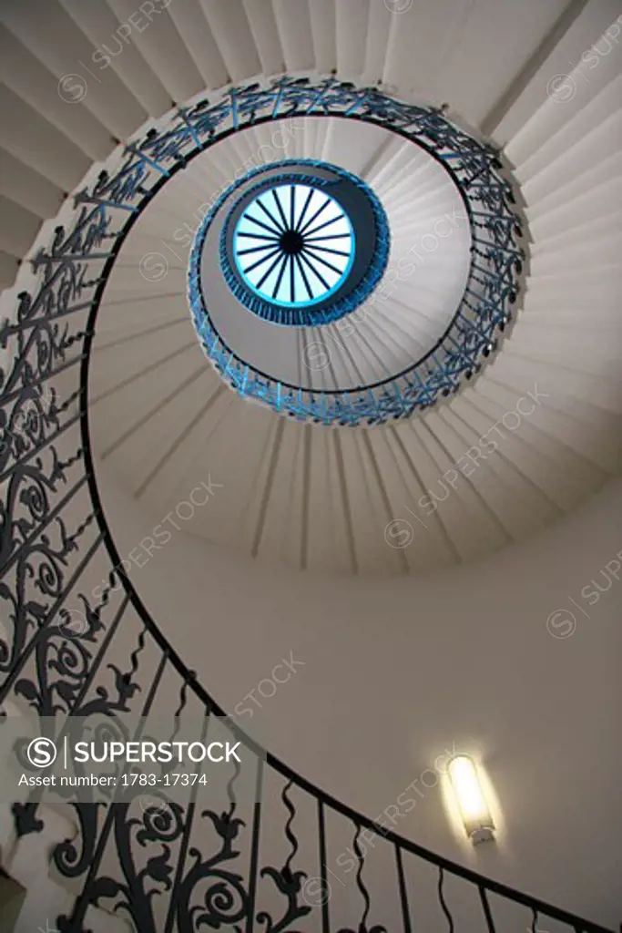 Looking up at a spiral staircase, London