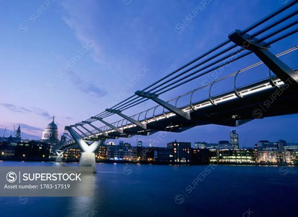Millennium Bridge and St Paul's Cathedral at dusk, London, England
