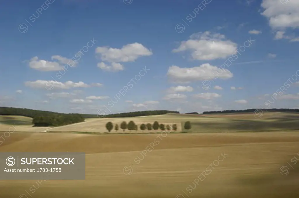 Travelling through the french countryside at high speed on a TGV train, Burgundy, France. 