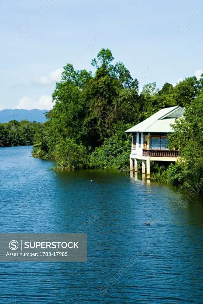 House surrounded by jungle on Besut River, Terengganu, Malaysia.