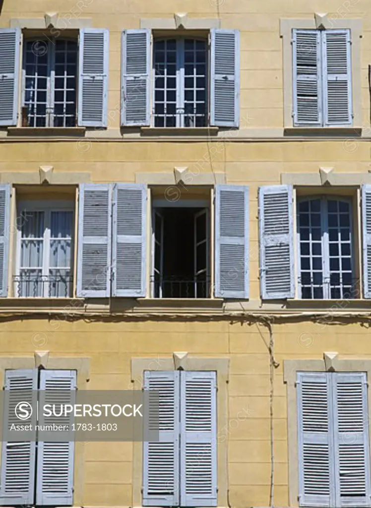 Detail of shuttered windows on house in Aix-en-Provence, France. 