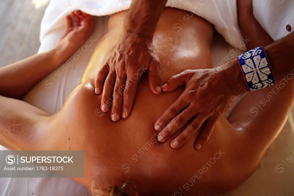 Detail of hands massaging a woman's back, spa, South of Puerto Vallarta, Pacific Coast, Mexico