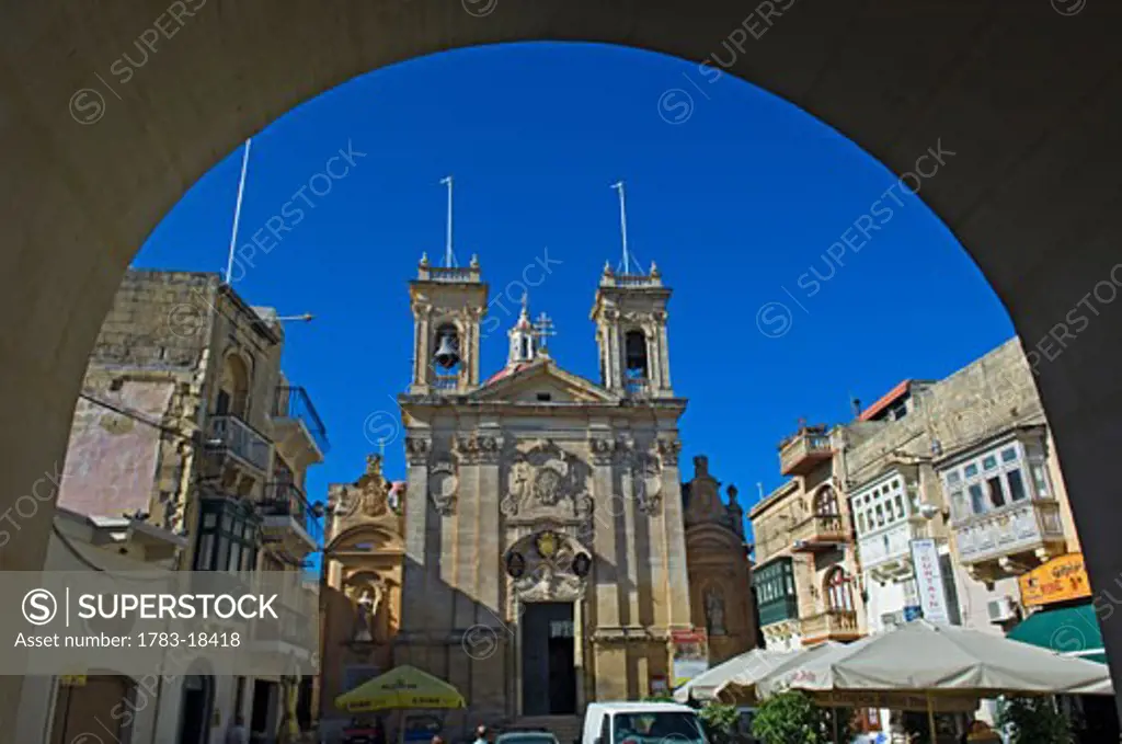 St George's Basilica through stone arch, Victoria, Gozo Island, Malta.