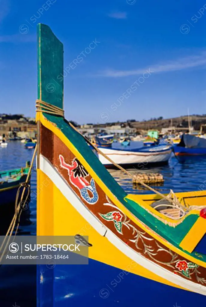 Traditional fishing boat in Luzzu harbor, Marsaxlokk, Malta.