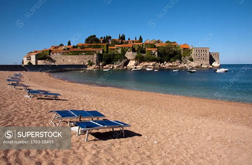 Private beach and townscape, Sveti Stefan, Montenegro.