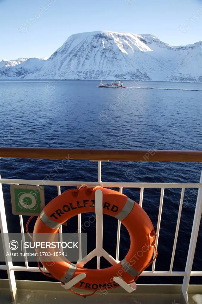 View of snowcapped mountains from ship, Norway.