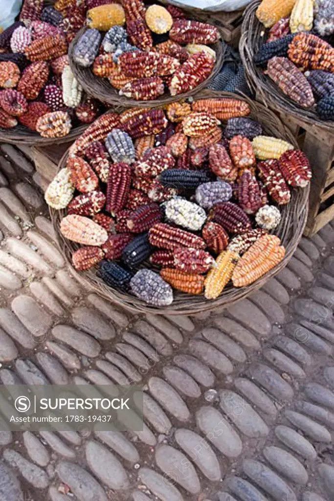 Baskets of corn for sale, Pisac, Sacred Valley, Peru.