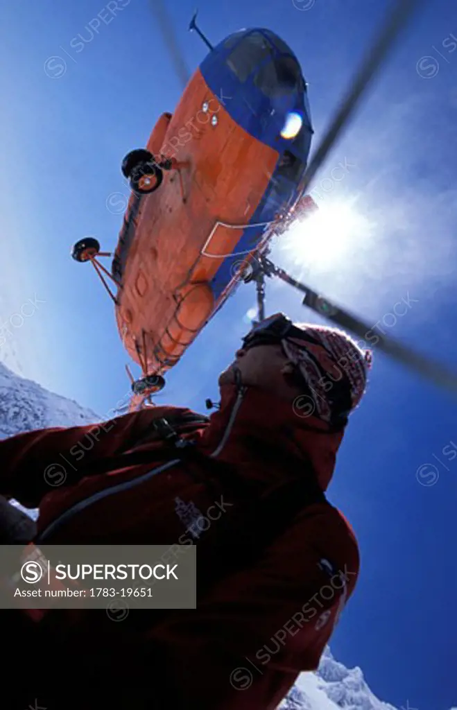 Skier and helicopter, Low Angle View, Kamchatka Peninsula, Russia