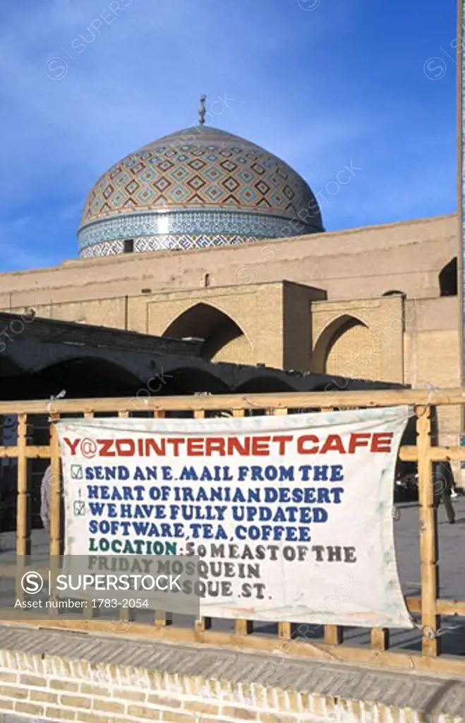 Sign for internet cafe in front of mosque dome, old vs. new, Jama Mosque, Yazd, Iran. 