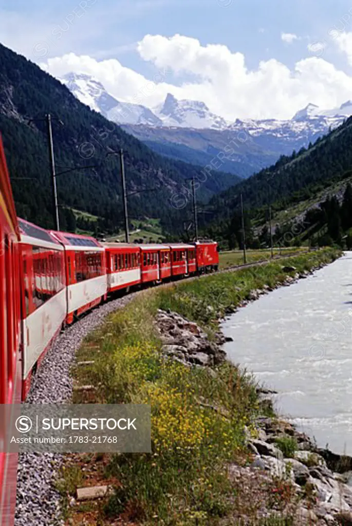 Glacier Express train with Alps in background, Switzerland 