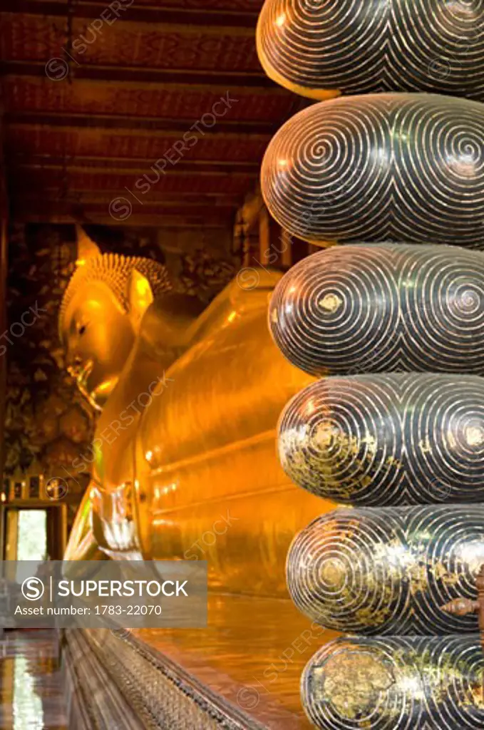 Detail of toes of large reclining buddha, Wat Pho temple, Bangkok, Thailand.