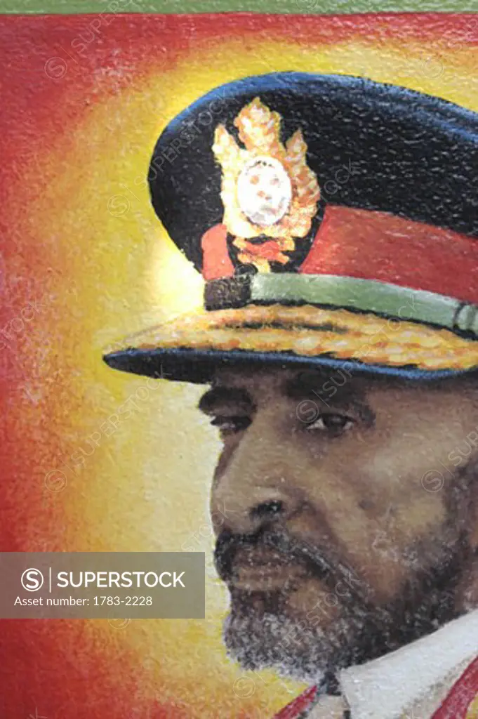 Painting of Haile Selassie on side of statue of Bob Marley, Bob Marley Museum, Kingston, Jamaica.