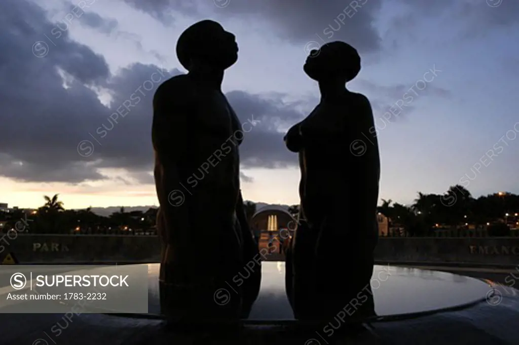 Statue in the Emancipation Park at dusk, Kingston, Jamaica. 