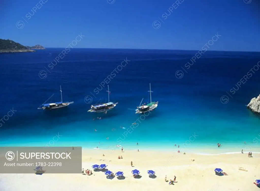 High angle view of beach and boats on sea, Turkey.