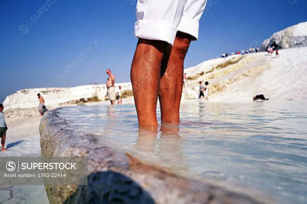 Tourists wading in Travertine pools, Pamukkale, Turkey