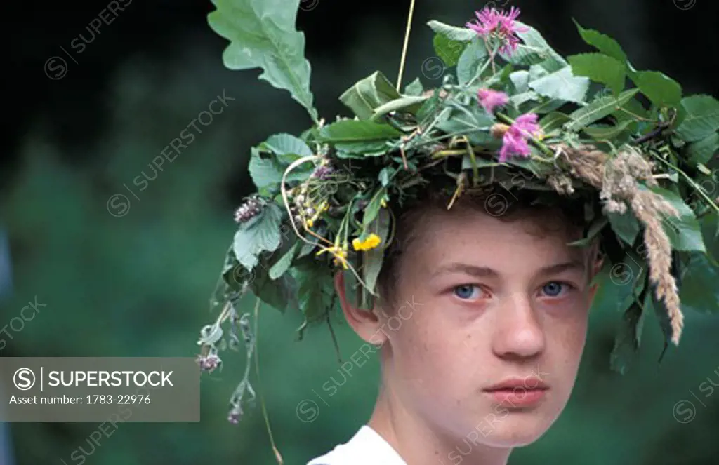 Boy wearing crown of thorns at funeral, Kalwaria Paclawska, Poland.