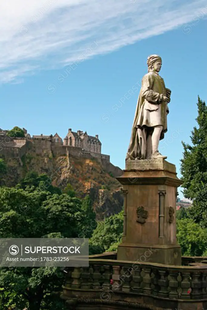 Allan Ramsay statue with Edinburgh Castle in the background on Prince Street, Edinburgh, Scotland