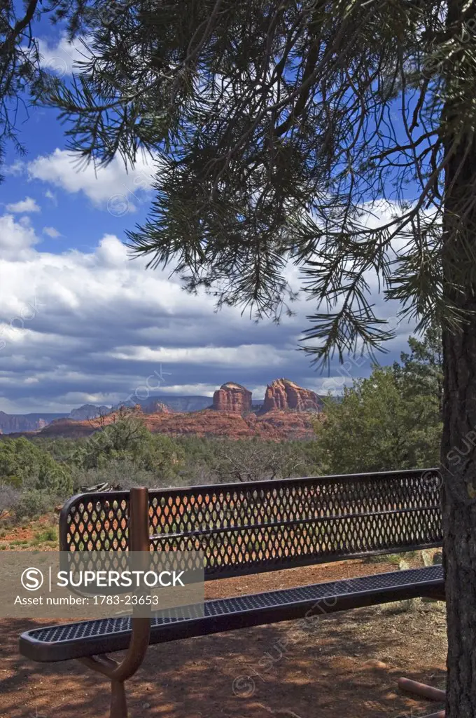 View across Red Rock State Park with a metal bench in the foreground. , Arizona, USA.