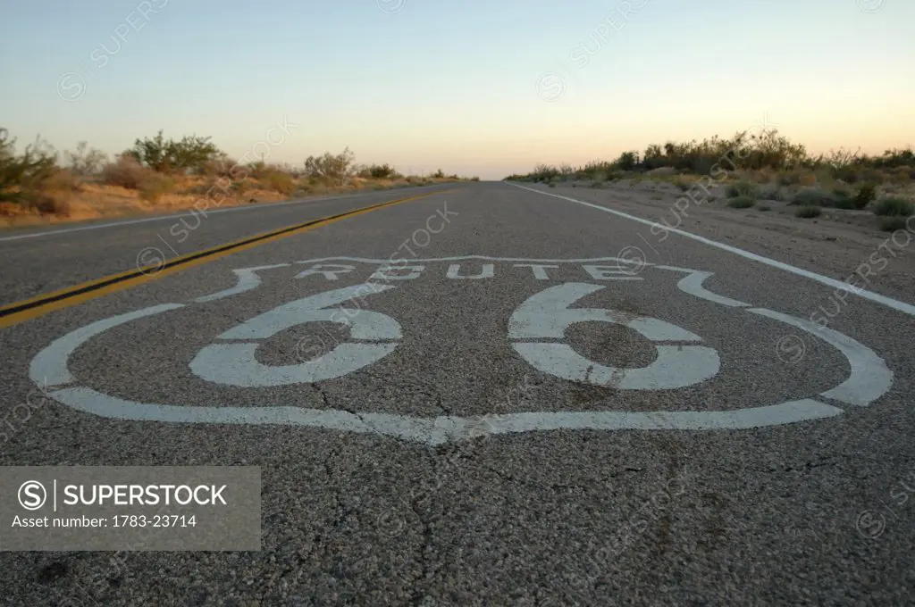 Route 66 sign painted on motorway in desert, California, USA 
