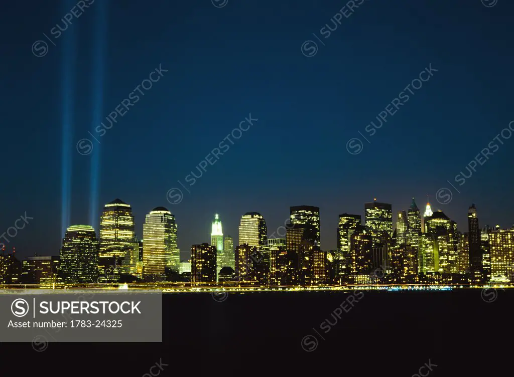 Lower Manhattan skyline and World Trade Centre memorial lights, New York City, New York, USA.