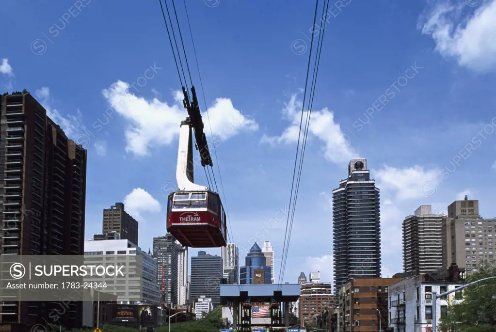 Ellis Island tramway and midtown skyline, Manhattan, New York City, USA.