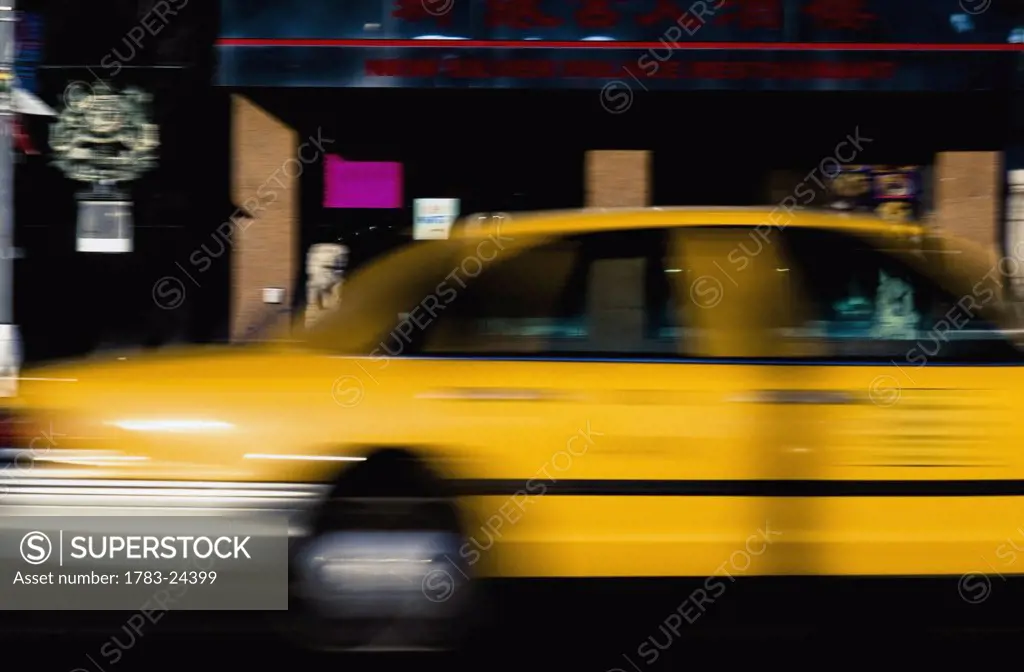 Blurred yellow taxi, New York City, New York, USA.