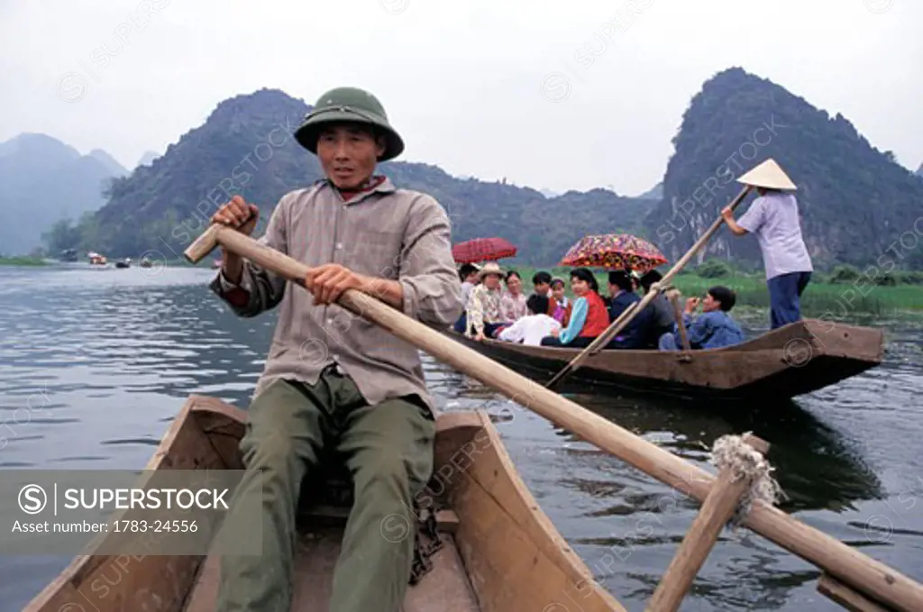Pilgrims on the Yen Vi River traveling to Huong Son Grotto for Huong Tich Festival, Yen Vi River, near Hanoi, Vietnam.