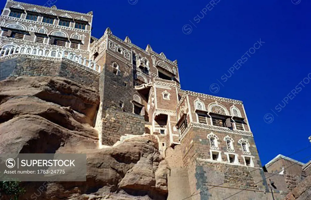 Buildings on rocks. , Dar al-Hajar (the Rock Palace)  built in the 1930's by Imam Yahya, Wadi Dahr, north of S'ana, Yemen.