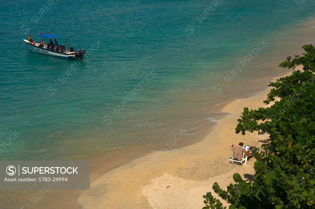 High angle view of scuba divers in a boat at Grand Anse Beach