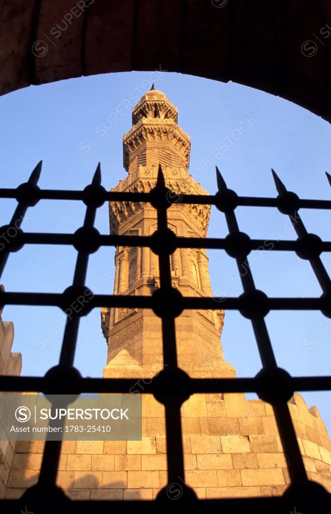 Low angle view through a gate of Minarets above Bab Zuwayla, Central Cairo, Cairo, Egypt