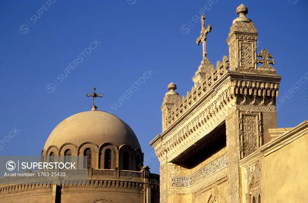 The churches of St George left and Al_Mullaqah right with a blue sky behind, Old Cairo, Egypt