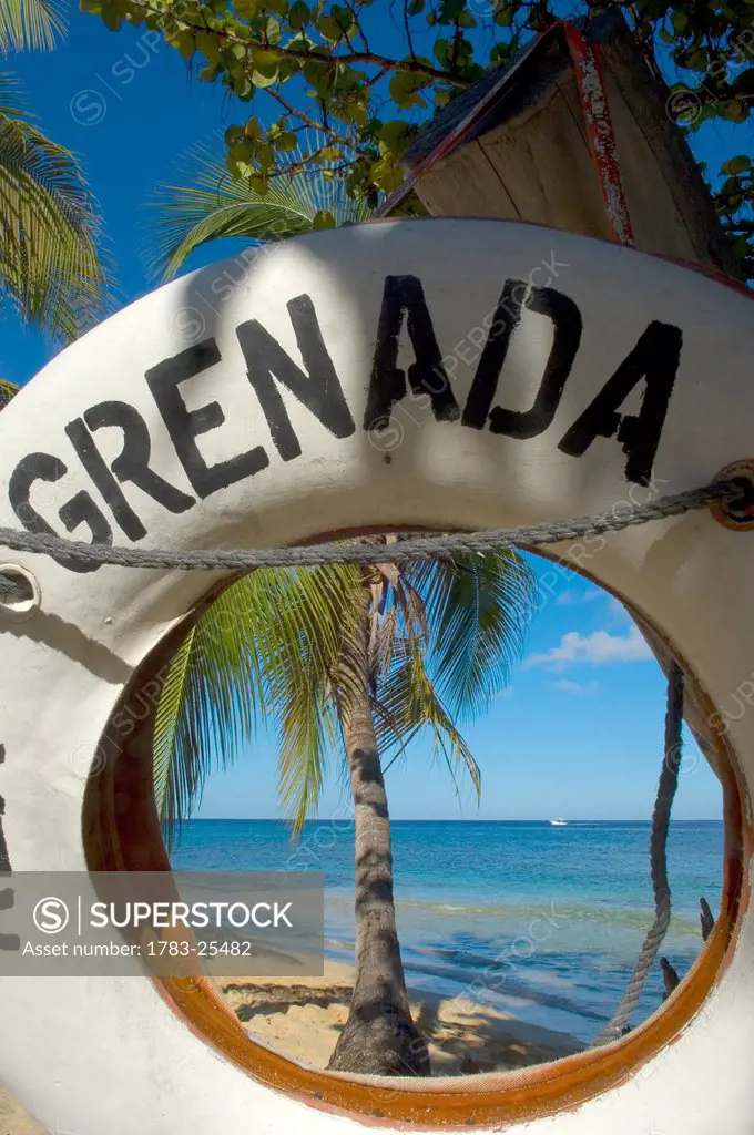 View through a life buoy with Grenada written on it.