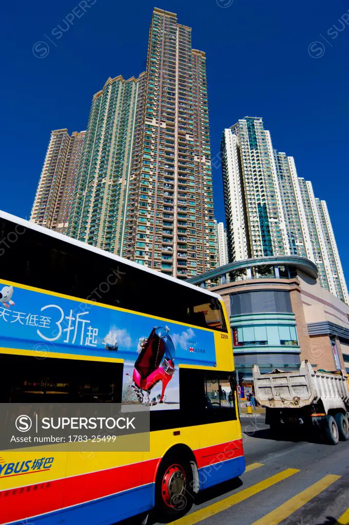 Low angle view of housing tower blocks and a bus in Kowloon, Hong Kong
