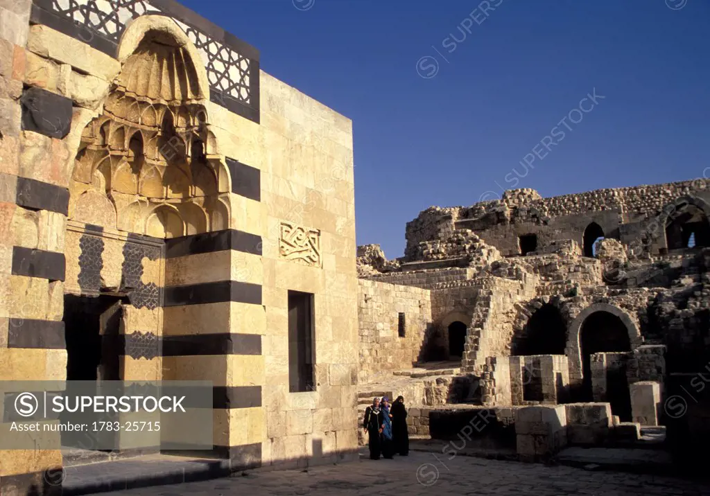 View of palace exterior and women, Ayyubid Palace entrance, Citadel, Aleppo, Syria