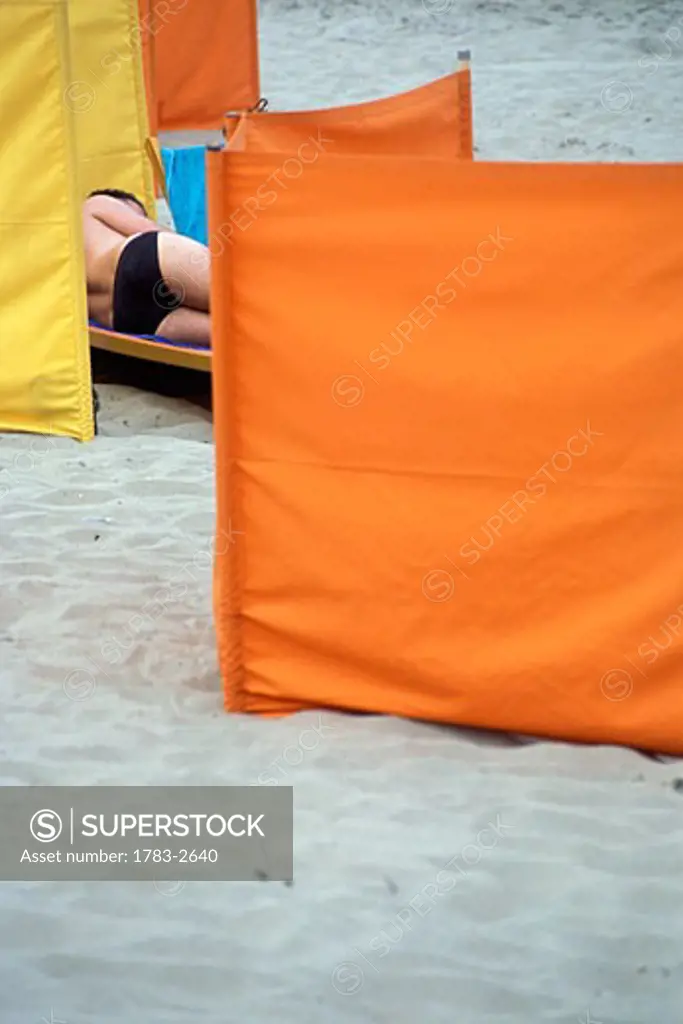 Noordwijk, Seaside, man lying on the beach, Netherlands.
