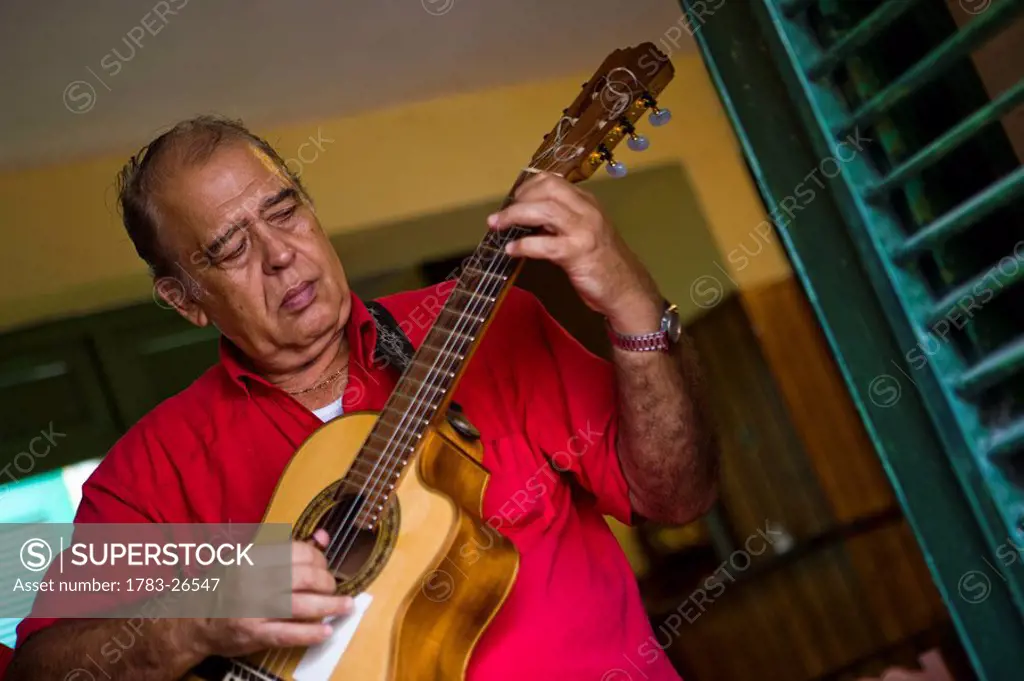 Musician playing in Bar Riley, Havana, Cuba