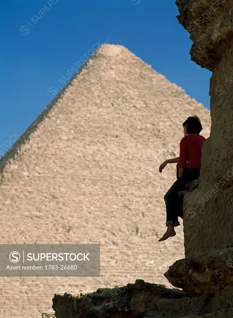 Woman admiring Great Pyramid of Cheops, Giza, Cairo, Egypt
