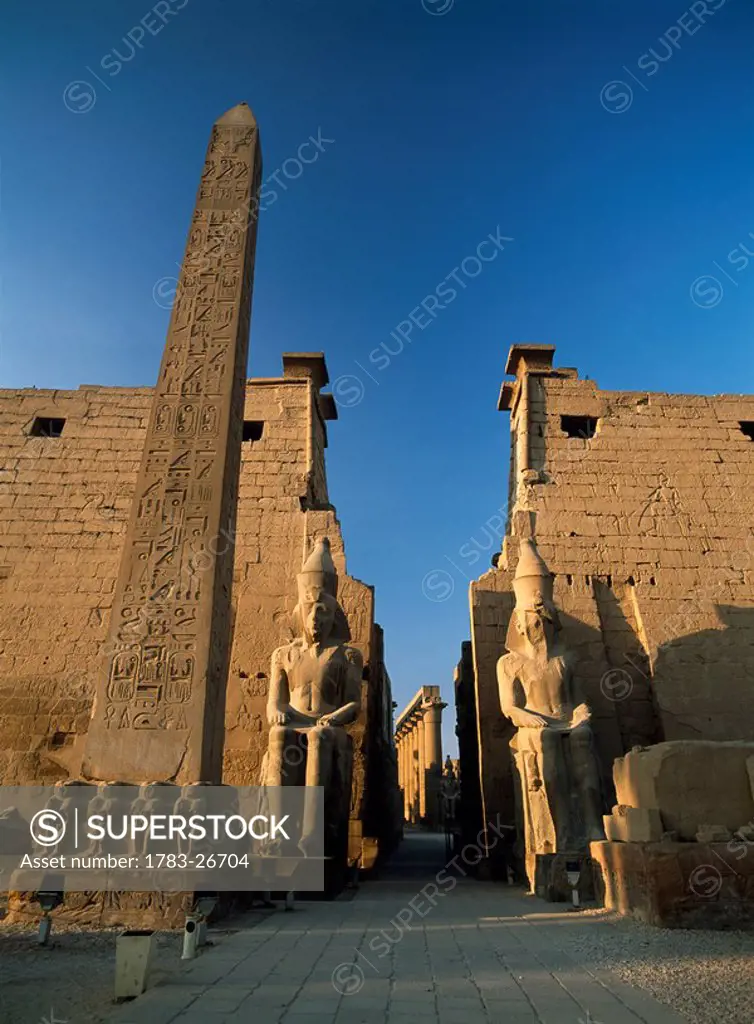 Obelisk and colossi of Ramses 2nd, Luxor Temple, Luxor, Egypt