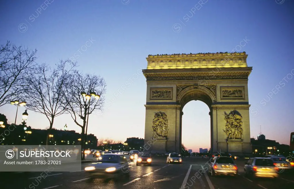 Arc du Triomphe at dusk with traffic, Paris
