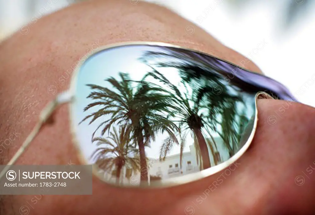 Palm trees reflected in a man's sunglasses , Vejer De La Frontera , Costa De La Luz , Andalusia/Andalucia, Southern Spain 