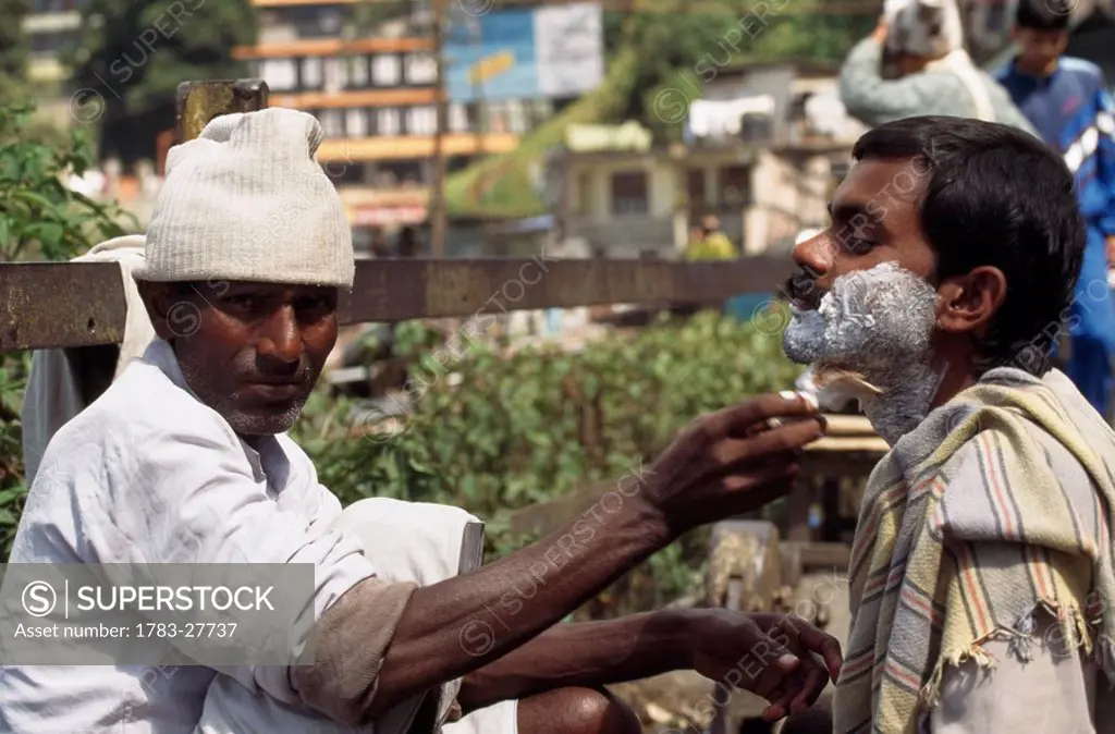 Streetside shave , Darjeeling, India