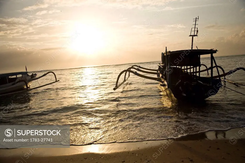 Boats silhouette at sunset, Sanur, Bali, Indonesia
