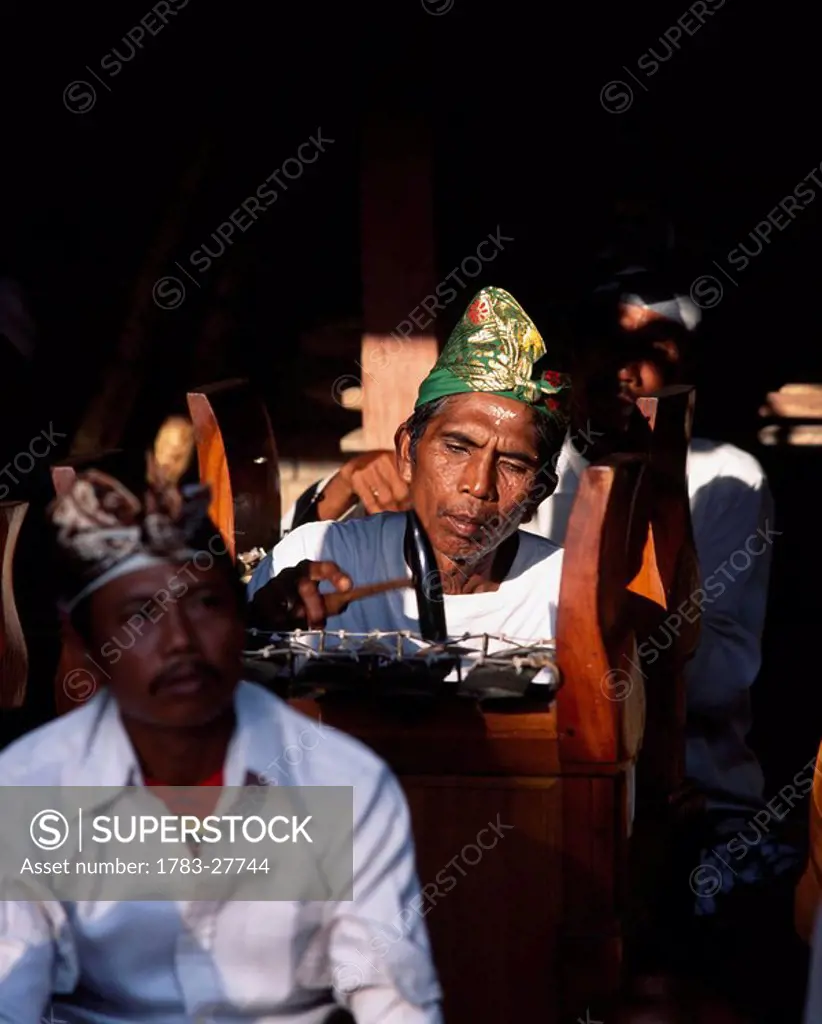Gamelan musicians Brass percussion, Bali, Indonesia.