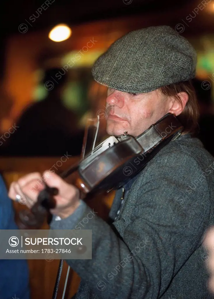 Musician in pub, Dublin, Ireland