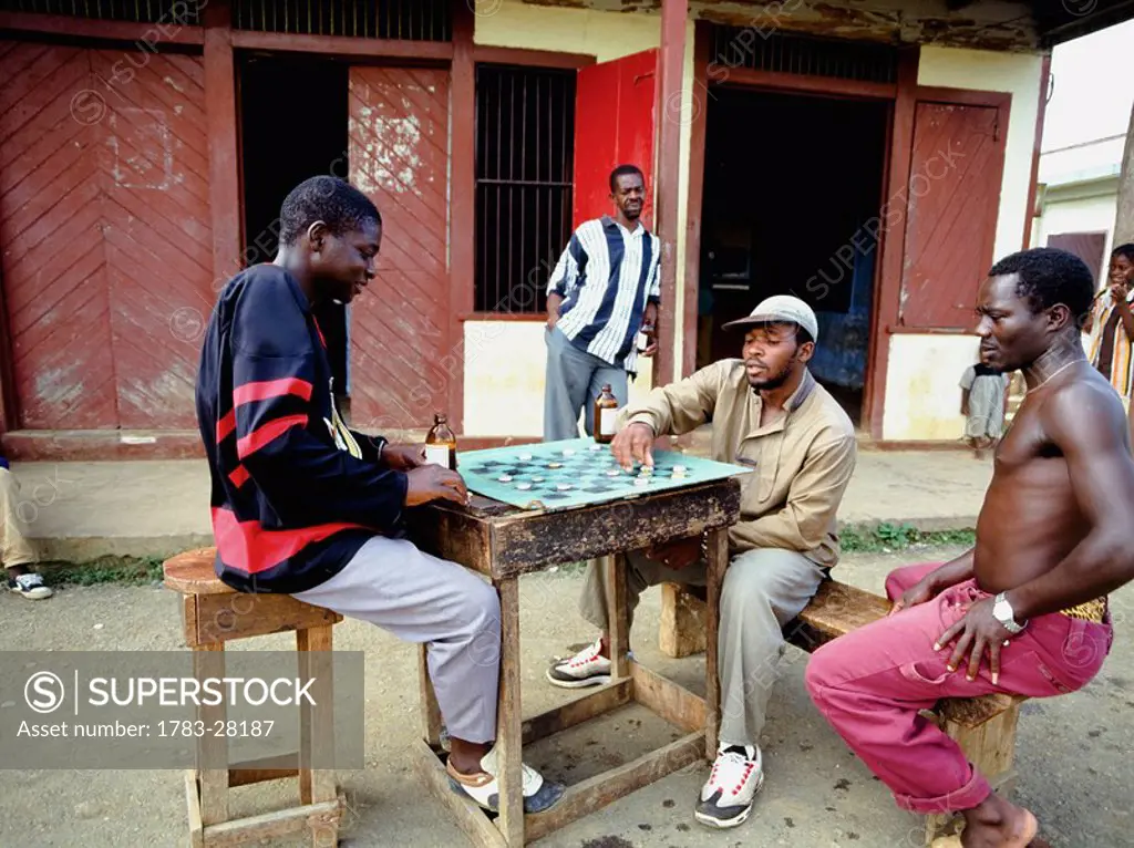 Men playing draughts in street, Jamaica