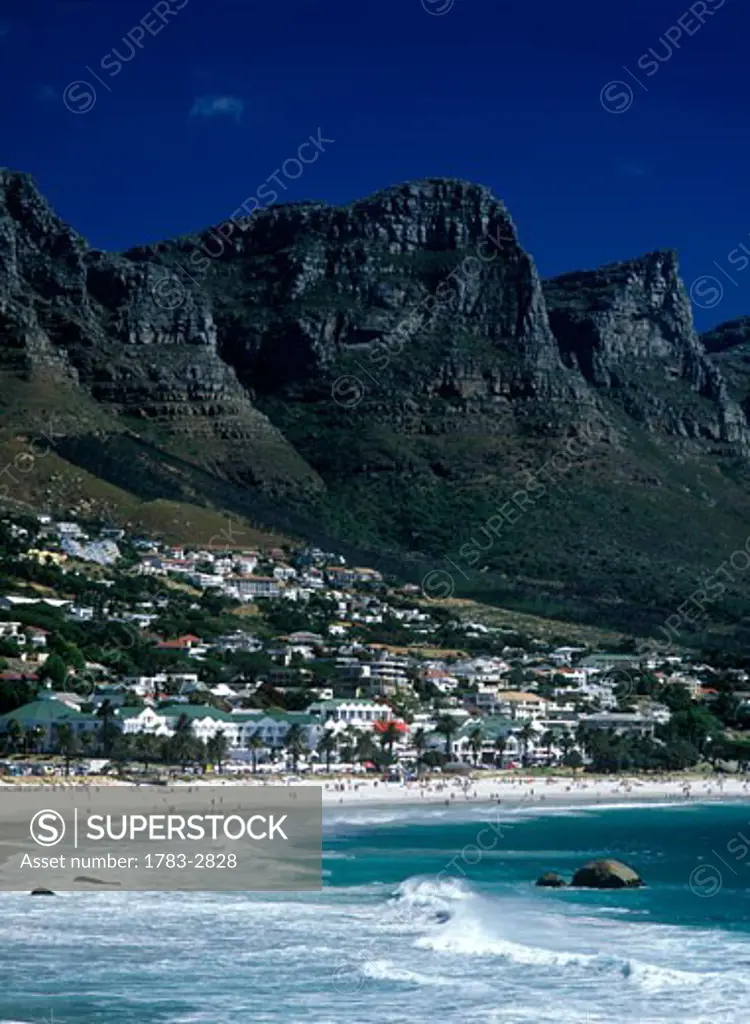 Looking along Clifton Beach with some of the Twelve Apostles above, Cape Town, South Africa. 