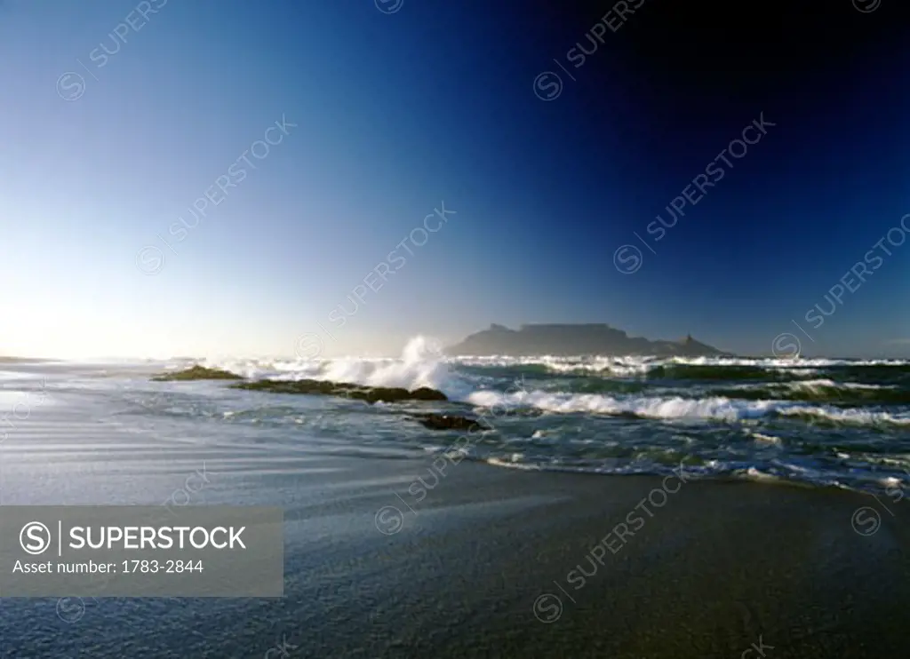 Looking over to Cape Town and Table Mountain at dawn seen from Blouberg Beach, South Africa