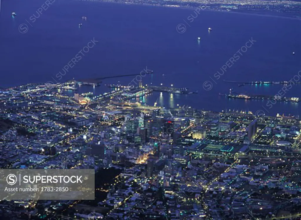 View of Cape Town centre and harbour as seen from the top of Table Mountain at dusk, South Africa. 