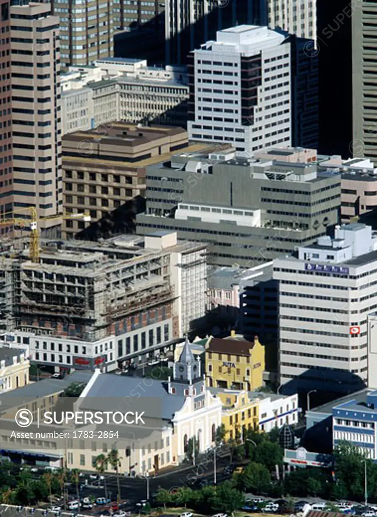 Large office blocks in the centre of Cape Town and harbour as seeen from the top of Table Mountain at dusk, South Africa.