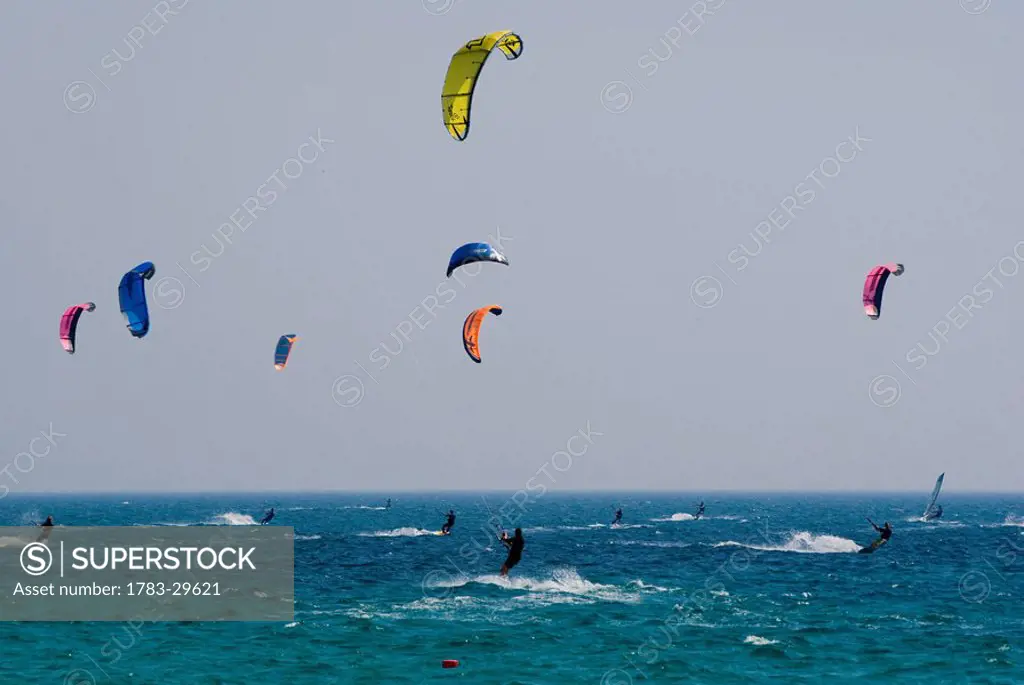 Kiteboarders in sea, Cadiz, Andalucia, Spain